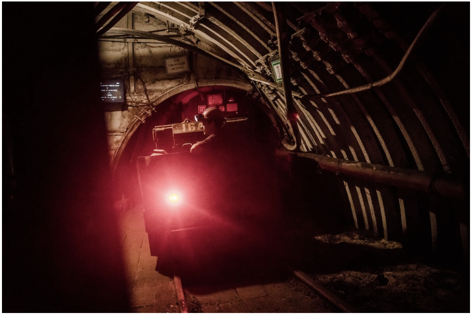 Coal miners travel by rail through miles of underground tunnels during their shift. (Wojciech Grzedzinski for The Washington Post)